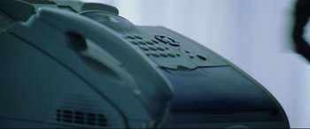Movie still from “Man on Fire” (2004), directed by Tony Scott – View of a phone on top of a desk; Extreme Close Up shot, High angle