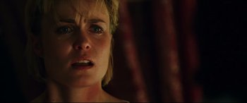 Movie still from “Man on Fire” (2004), directed by Tony Scott – A woman's face as she stares into the camera; Close Up shot, Low angle