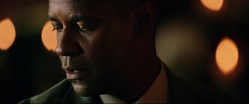 Movie still from “Man on Fire” (2004), directed by Tony Scott – A man in a suit and tie; Close Up shot, Low angle