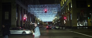Movie still from “Maniac” (2012), directed by Franck Khalfoun – A man crossing the street at night in a city; Wide shot, Low angle