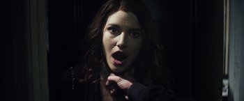 Movie still from “Maniac” (2012), directed by Franck Khalfoun – A person with her mouth wide open; Close Up shot, Over the shoulder angle