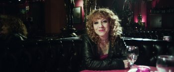 Movie still from “Maniac” (2012), directed by Franck Khalfoun – A woman sitting on a chair in front of a mirror; Medium shot, High angle