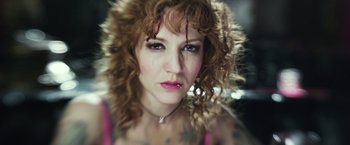 Movie still from “Maniac” (2012), directed by Franck Khalfoun – A person wearing a necklace; Close Up shot, Overhead angle