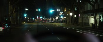 Movie still from “Maniac” (2012), directed by Franck Khalfoun – A view of a street at night from a car window; Extreme Wide shot, High angle