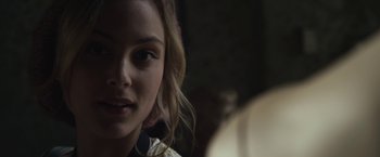 Movie still from “Maniac” (2012), directed by Franck Khalfoun – A woman's face in a dark room; Close Up shot, Over the shoulder angle