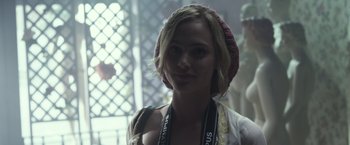 Movie still from “Maniac” (2012), directed by Franck Khalfoun – A woman wearing a pink hat and a white shirt; Close Up shot, Over the shoulder angle