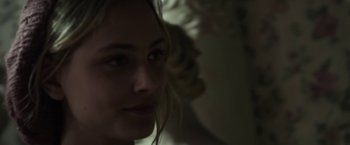 Movie still from “Maniac” (2012), directed by Franck Khalfoun – A woman's face in the dark; Close Up shot, Over the shoulder angle