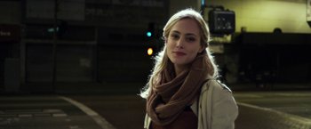 Movie still from “Maniac” (2012), directed by Franck Khalfoun – A beautiful young lady standing on the side of a road; Close Up shot, Over the shoulder angle