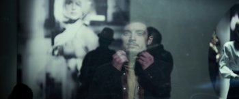 Movie still from “Maniac” (2012), directed by Franck Khalfoun – A man standing in front of a mirror holding a knife in his hand; Close Up shot, Low angle