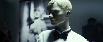 Movie still from “Maniac” (2012), directed by Franck Khalfoun – A male mannequin wearing a white shirt and black bow tie; Extreme Close Up shot, Low angle