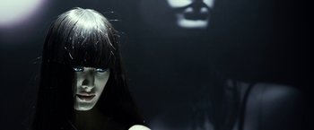 Movie still from “Maniac” (2012), directed by Franck Khalfoun – A woman's face is reflected in a mirror; Extreme Close Up shot, High angle