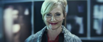 Movie still from “Maniac” (2012), directed by Franck Khalfoun – A person smiling for the camera; Close Up shot, High angle