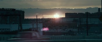Movie still from “Maniac” (2012), directed by Franck Khalfoun – The sun is setting over a large city; Extreme Wide shot, Low angle