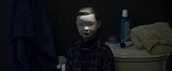 Movie still from “Maniac” (2012), directed by Franck Khalfoun – A doll with a plaid shirt and a black shirt on it; Close Up shot, High angle