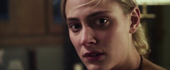 Movie still from “Maniac” (2012), directed by Franck Khalfoun – A woman's face with a serious look; Close Up shot, Over the shoulder angle