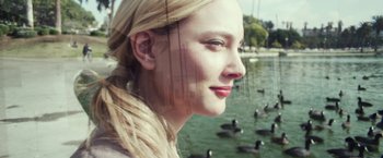 Movie still from “Maniac” (2012), directed by Franck Khalfoun – A woman standing in front of a body of water; Close Up shot, Low angle