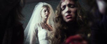 Movie still from “Maniac” (2012), directed by Franck Khalfoun – Two women dressed up as a bride and a princess; Close Up shot, Over the shoulder angle