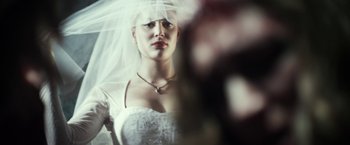 Movie still from “Maniac” (2012), directed by Franck Khalfoun – A woman in a white wedding dress with a veil; Extreme Close Up shot, Low angle