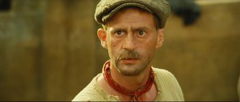 Movie still from “Manon of the Spring” (1986), directed by Claude Berri – A person wearing a hat; Close Up shot, Low angle