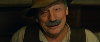 Movie still from “Manon of the Spring” (1986), directed by Claude Berri – An older man with a mustache and a hat; Close Up shot, Low angle