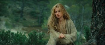 Movie still from “Manon of the Spring” (1986), directed by Claude Berri – A beautiful young woman with long blonde hair; Medium shot, High angle