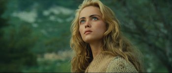 Movie still from “Manon of the Spring” (1986), directed by Claude Berri – A beautiful young woman with long blonde hair and blue eyes; Close Up shot, Low angle