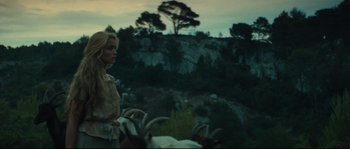 Movie still from “Manon of the Spring” (1986), directed by Claude Berri – A woman standing next to a herd of goats; Wide shot, Low angle