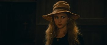 Movie still from “Manon of the Spring” (1986), directed by Claude Berri – A woman wearing a brown hat looking at the camera; Close Up shot, Over the shoulder angle