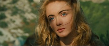A woman's face with blue eyes