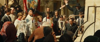 A group of people standing in front of a crowd