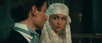 Movie still from “Manon of the Spring” (1986), directed by Claude Berri – A young woman in a white veil looking at a young man; Close Up shot, Over the shoulder angle