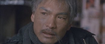 Movie still from “Map of the Human Heart” (1992), directed by Vincent Ward – A person with a beard; Close Up shot, Low angle