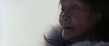 Movie still from “Map of the Human Heart” (1992), directed by Vincent Ward – An older woman with a fur coat on her face; Extreme Close Up shot, Low angle