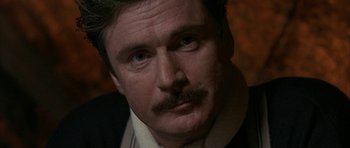 Movie still from “Map of the Human Heart” (1992), directed by Vincent Ward – A person with a mustache; Close Up shot, Over the shoulder angle