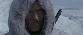 Movie still from “Map of the Human Heart” (1992), directed by Vincent Ward – A person wearing a fur coat; Close Up shot, Over the shoulder angle