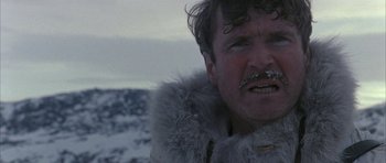 Movie still from “Map of the Human Heart” (1992), directed by Vincent Ward – A person wearing a fur coat; Close Up shot, Low angle