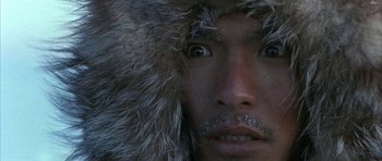 Movie still from “Map of the Human Heart” (1992), directed by Vincent Ward – A person wearing a fur hat; Extreme Close Up shot, High angle