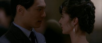 Movie still from “Map of the Human Heart” (1992), directed by Vincent Ward – A man and a woman face to face in front of a wall; Close Up shot, Over the shoulder angle