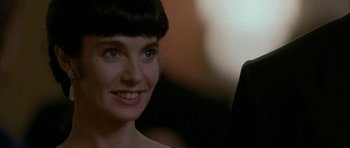 Movie still from “Map of the Human Heart” (1992), directed by Vincent Ward – A person smiling for the camera; Close Up shot, Over the shoulder angle
