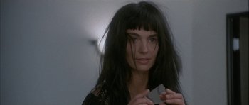 Movie still from “Map of the Human Heart” (1992), directed by Vincent Ward – A person holding a cell phone; Close Up shot, Over the shoulder angle