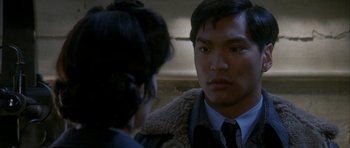 Movie still from “Map of the Human Heart” (1992), directed by Vincent Ward – A man and a woman talking to each other; Close Up shot, Over the shoulder angle