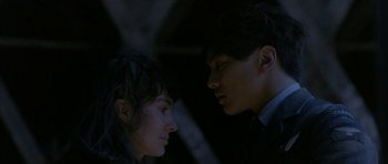 Movie still from “Map of the Human Heart” (1992), directed by Vincent Ward – A man and a woman looking at one another; Close Up shot, Low angle
