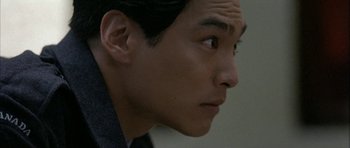 Movie still from “Map of the Human Heart” (1992), directed by Vincent Ward – A man's face looking to his left; Close Up shot, Low angle