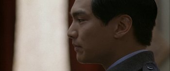 Movie still from “Map of the Human Heart” (1992), directed by Vincent Ward – A man's face in profile; Close Up shot, Low angle