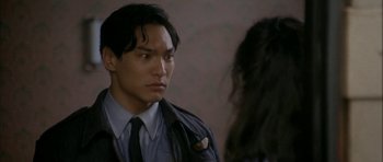 Movie still from “Map of the Human Heart” (1992), directed by Vincent Ward – A man and a woman are looking at one another; Close Up shot, Over the shoulder angle