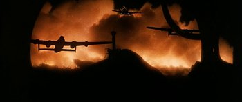 Movie still from “Map of the Human Heart” (1992), directed by Vincent Ward – A group of planes flying in the sky at night; Extreme Wide shot, Low angle