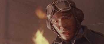 Movie still from “Map of the Human Heart” (1992), directed by Vincent Ward – A person wearing a helmet and goggles; Close Up shot, Low angle