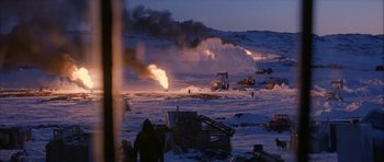 Movie still from “Map of the Human Heart” (1992), directed by Vincent Ward – An image of an open field with a lot of smoke coming out of it; Extreme Wide shot, High angle