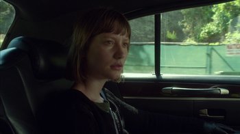 Movie still from “Maps to the Stars” (2014), directed by David Cronenberg – A woman sitting in the passenger seat of a car; Close Up shot, Over the shoulder angle