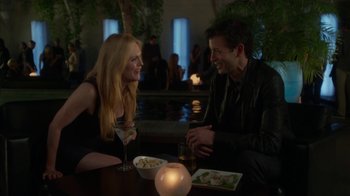 Movie still from “Maps to the Stars” (2014), directed by David Cronenberg – A man and a woman sitting at a table with a drink; Medium shot, Over the shoulder angle